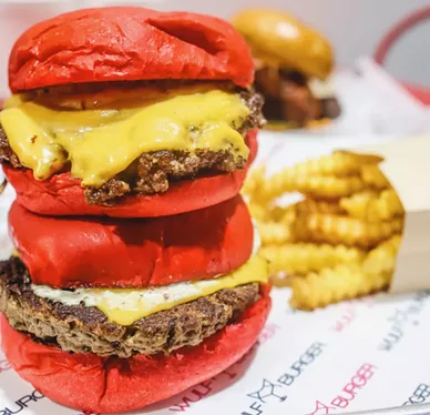 Wulf Burger's vegan burger, bottom, is tough to distinguish from their regular burger up top. - JORDAN WILLIAMS