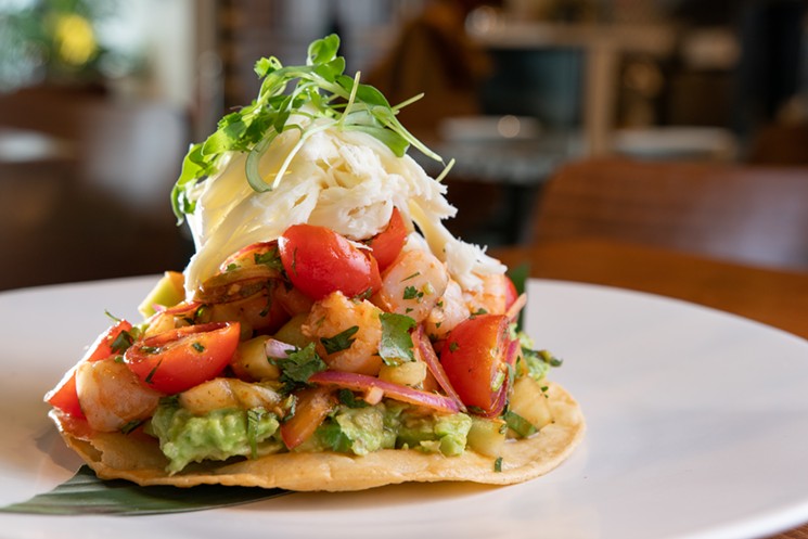 The tostada fresca built with a layer of mashed avocadoes topped with shrimp and Oaxacan cheese. - ALISON MCLEAN