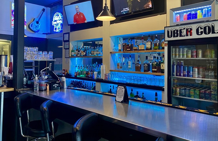 A full bar with the blue backlight says all we need to know about Uncle Uber's new curfew. - LAUREN DREWES DANIELS