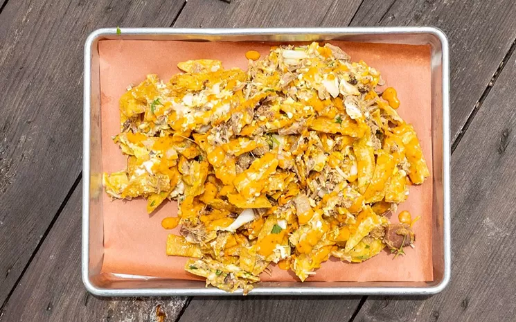 Hurtado's brunch migas, served Friday through Sunday, are made with house-fried tortilla strips and topped with Savage Sauce. - SEAN WELCH