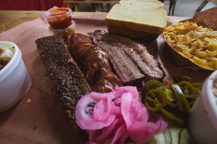 Helberg Barbecue loves the tradition of Texas barbecue, expressed here as the Texas Trinity of ribs, sausage and brisket. - CHRIS WOLFGANG