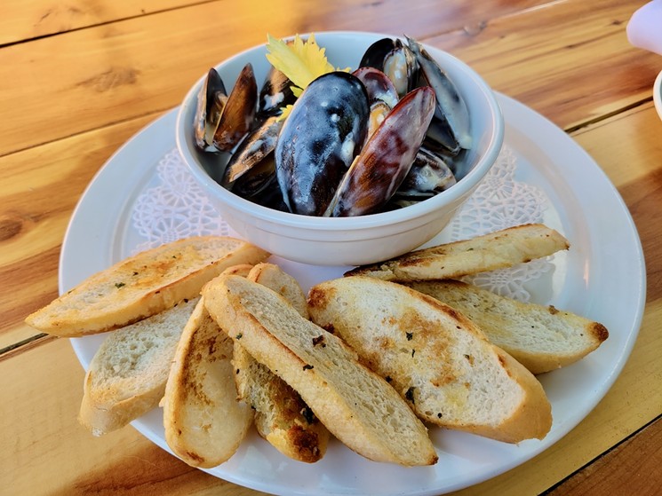 The best part of the drunken mussels is waiting at the bottom of the bowl. - EMAYNE