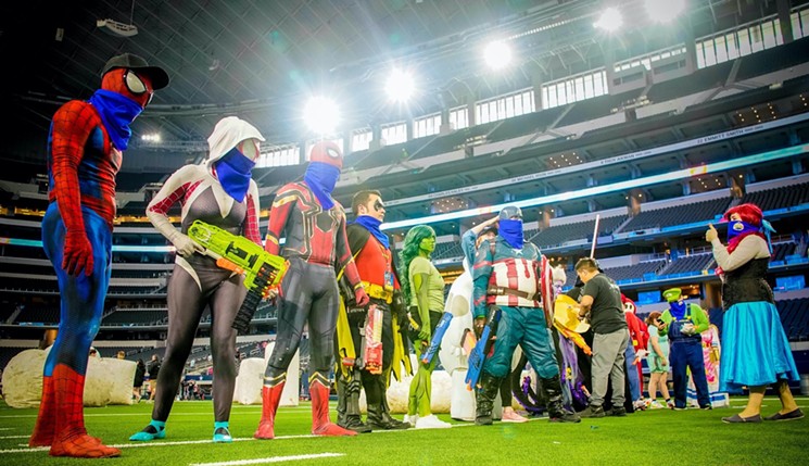 A group of costumed heroes wait for the starting signal at Jared's Epic Nerd Battle 4 in 2019 at AT&T Stadium. - MICHAEL CARIAGA