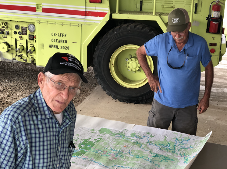 Gary Cheatwood and John Brooks display a map of the propose Martin Nichols Reservoir. - JACOB VAUGHN