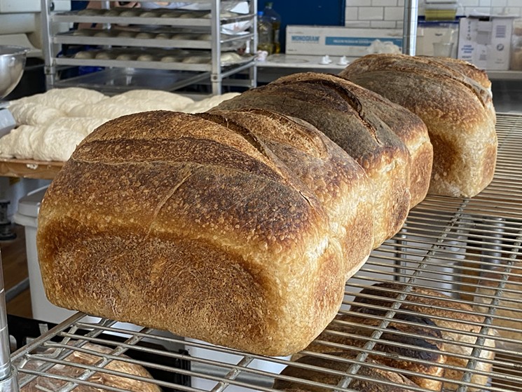 The smell of warm sourdough makes for tempting add ons to your purchase at La Casita Bakeshop. - CHRIS WOLFGANG