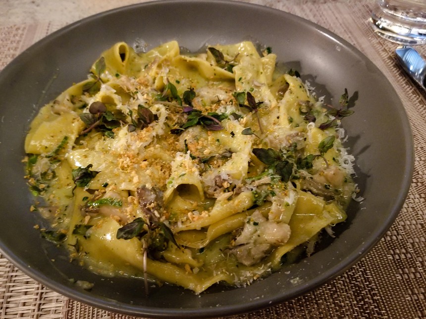 Pappardelle is served with grilled prawns in a sauce with garlic, black trumpet mushroom and parmesan. - CINDY JU VAUGHN