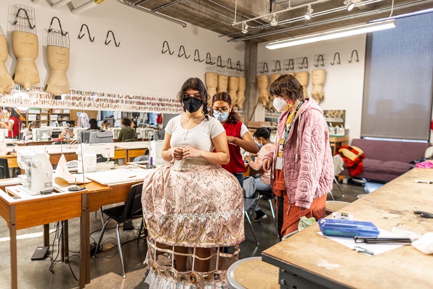 Dressmaking in a theater and sewing class. - KATHY TRAN