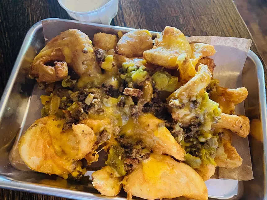 Not all food photographs well, but don't hold that against these Heisenberg fries topped with cheese, Hatch chili peppers and seasoned ground beef. - LAUREN DREWES DANIELS