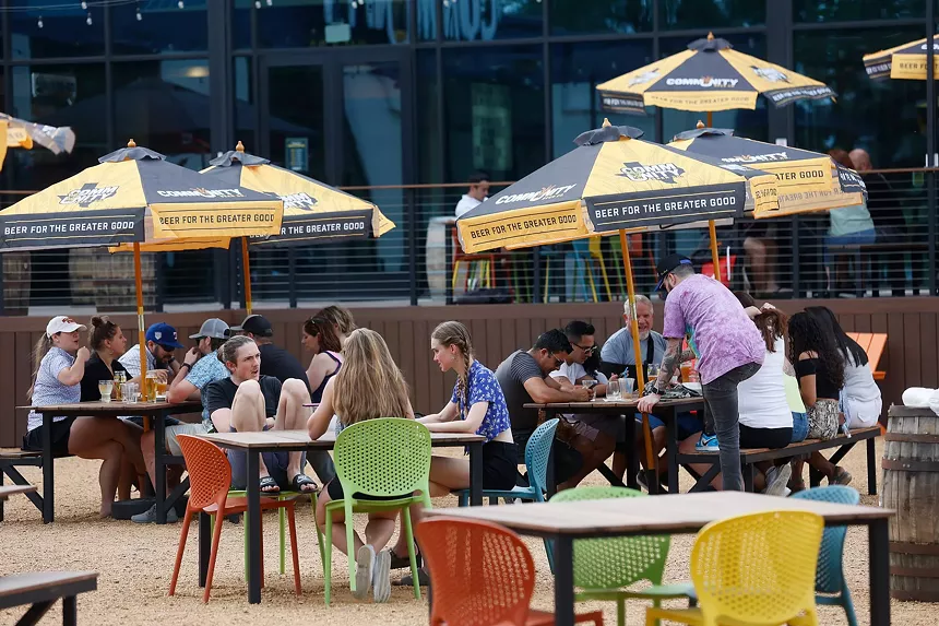 Community Beer Co.'s massive courtyard is a destination for craft beer enthusiasts and their families. - NATHAN HUNSINGER