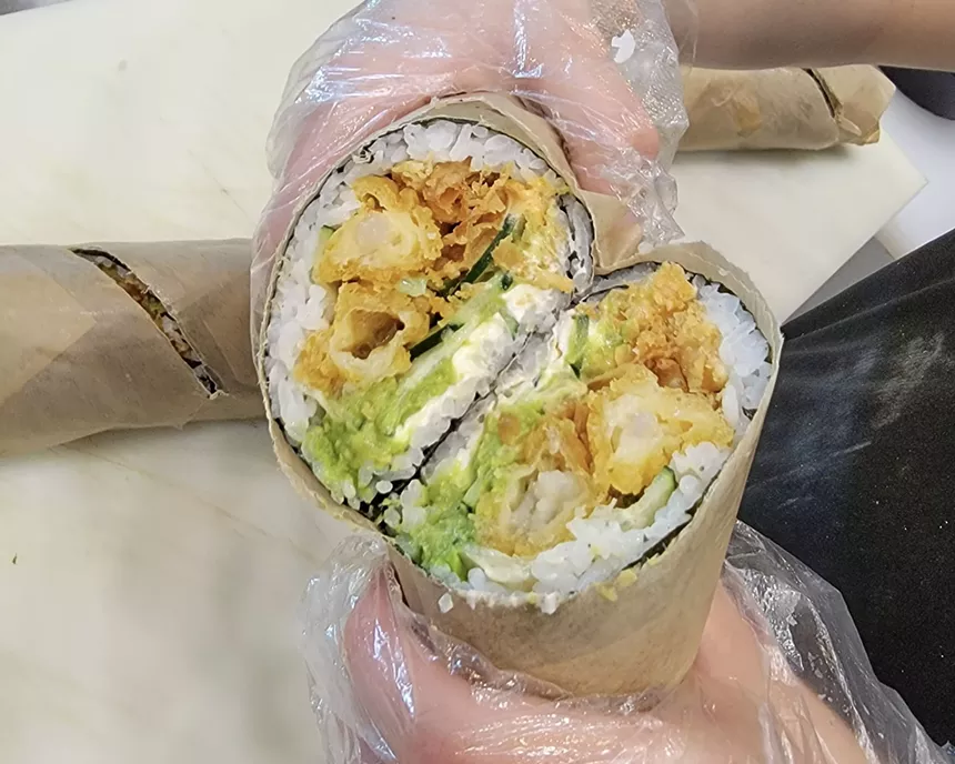 Sushi burrito can be made with a variety of proteins and rice, wrapped in a thin sheet of seaweed. Go ahead, Carlos Gonzalez