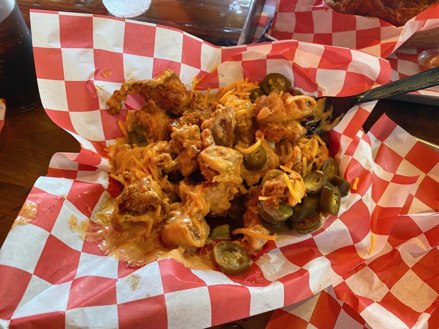 The loaded waffle fries are a full meal with mostly thick chunks of chicken and only a handful of fries at the bottom. - LAUREN DREWES DANIELS
