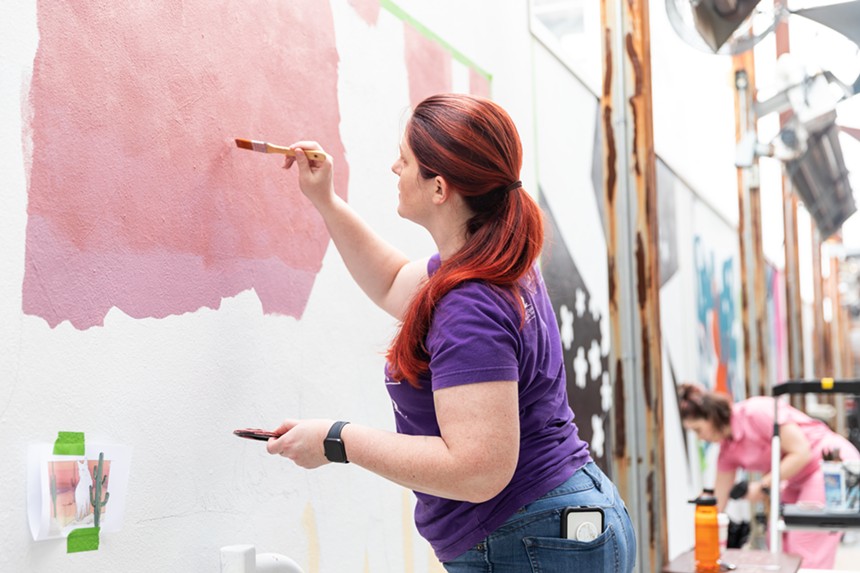 Ohio transplant Ashley Villers works on her mural, inspired by the local lanscape. - NARCISO TOVAR