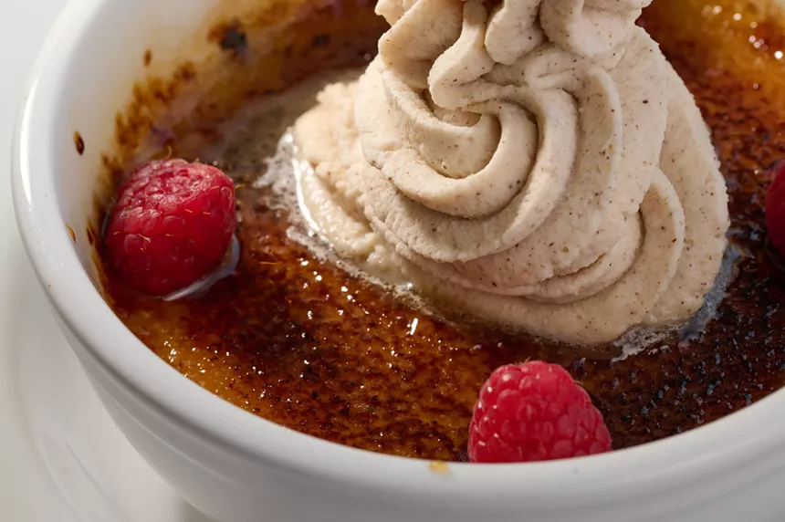 Creme brulee dessert is topped with a little cinnamon whipped cream. - Alison McClain