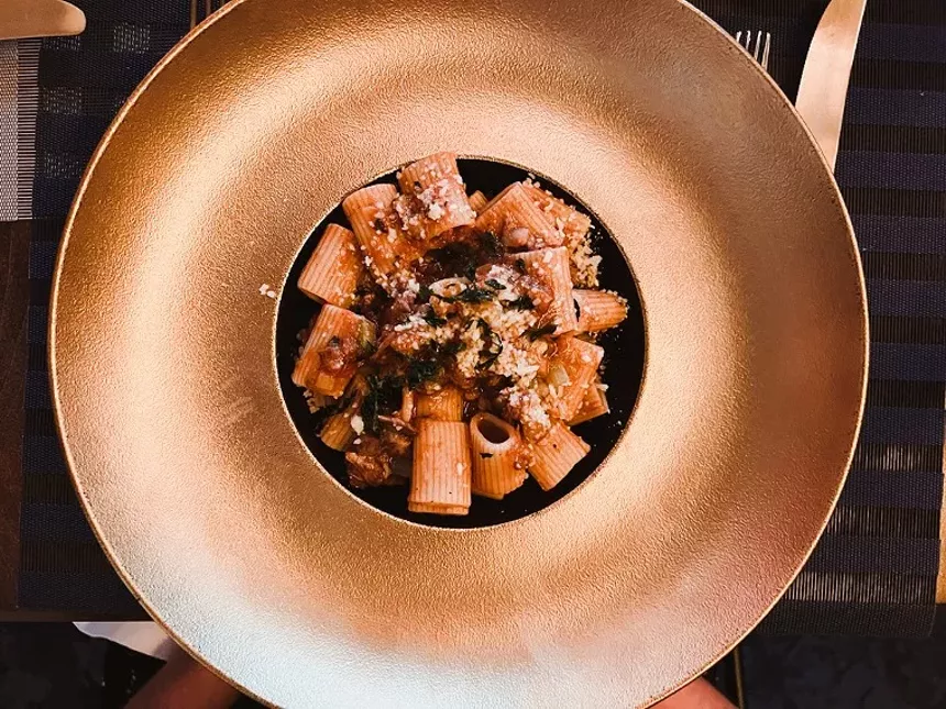 Lacoda, oxtail tomatoes and white wine sauce served with rigatoni - Chris Wolfgang
