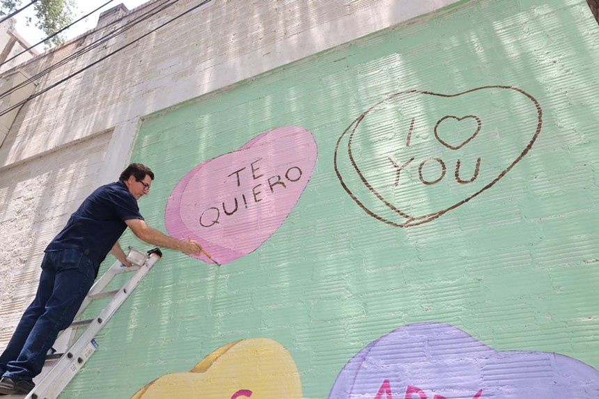 Art Lab Contemporary owner Abel Ortiz paints Uvalde mural.