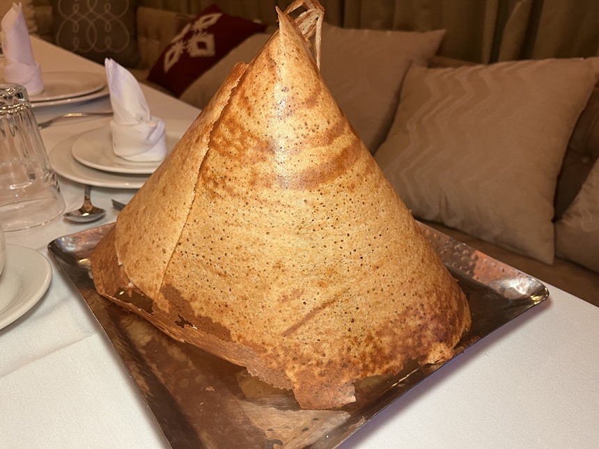 A South Indian dosa, which is a crepe folded in a conical shape.