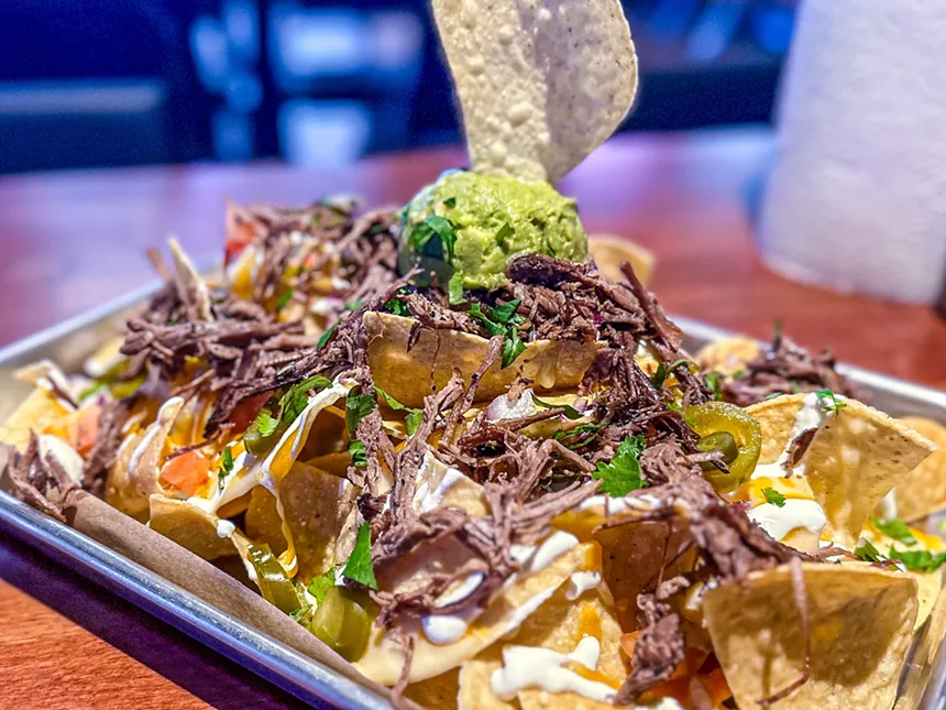 Nachos stacked with brisket.