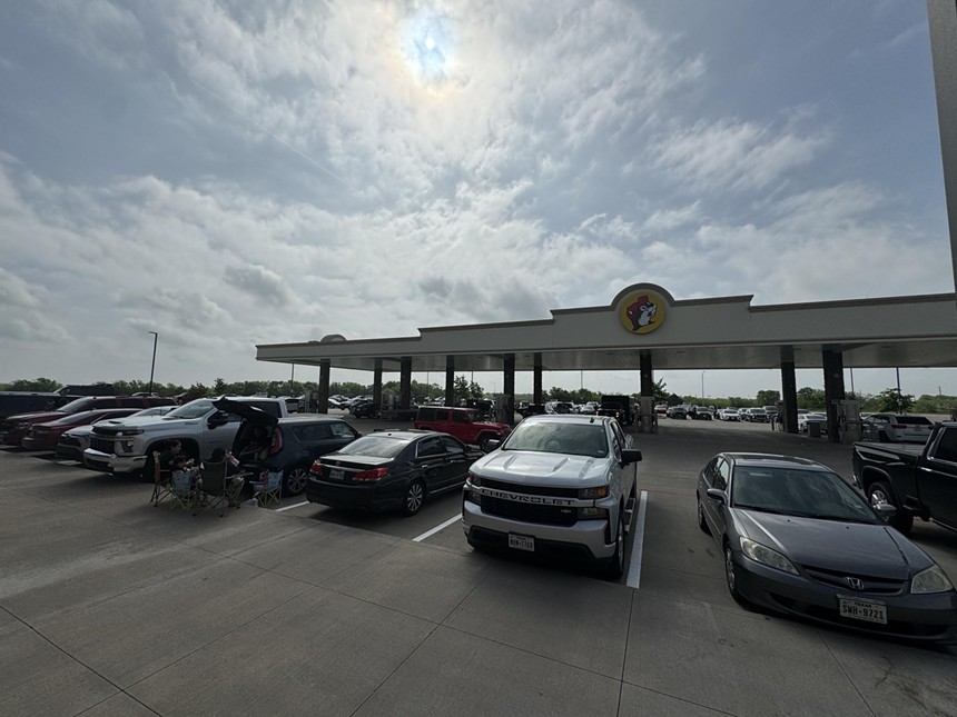 Tailgaters await the start of the eclipse at Buc-ee's in Ennis.
