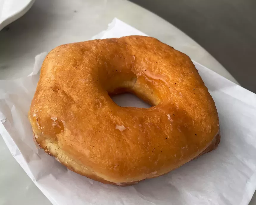 Doughnut on a plate at Hola Café