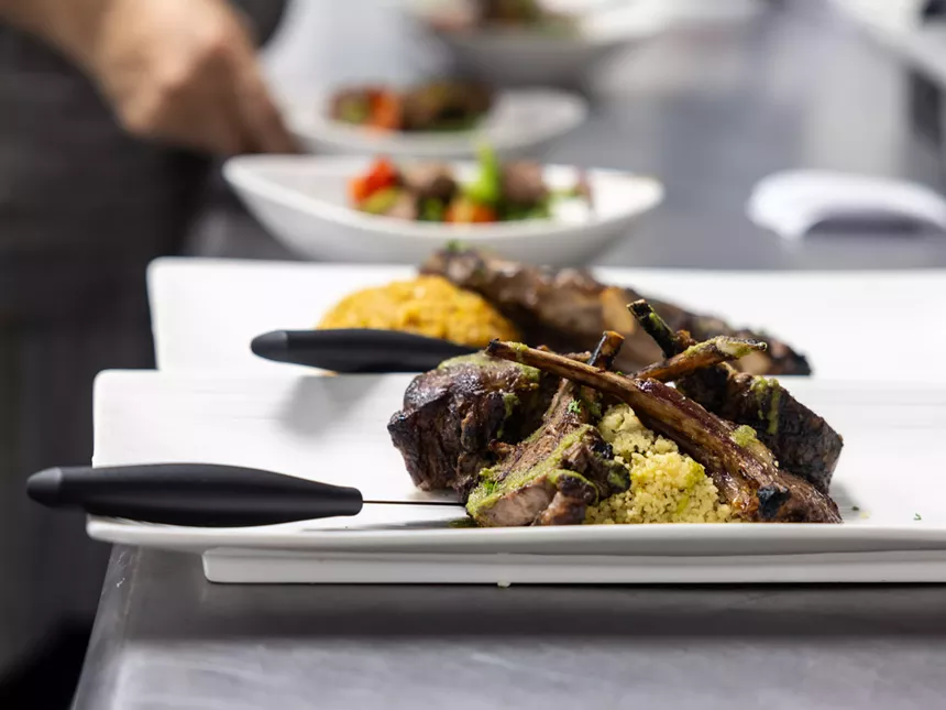 lamb chops over jollof.