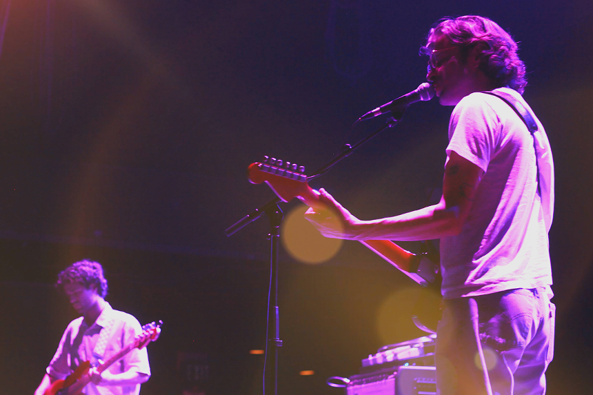 Man playing guitar on stage