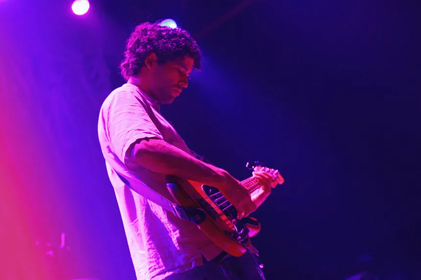 Man performing with guitar