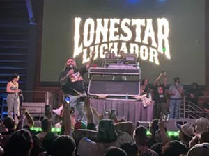 Man rapping on stage
