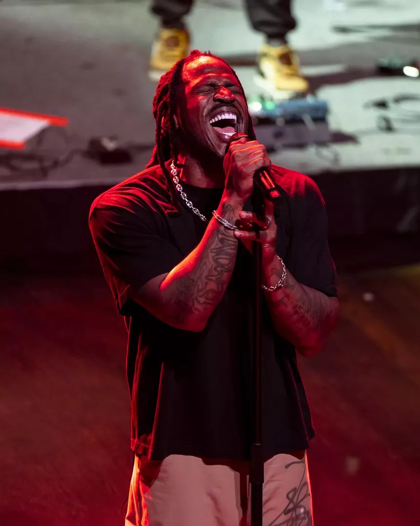 Man on stage performing