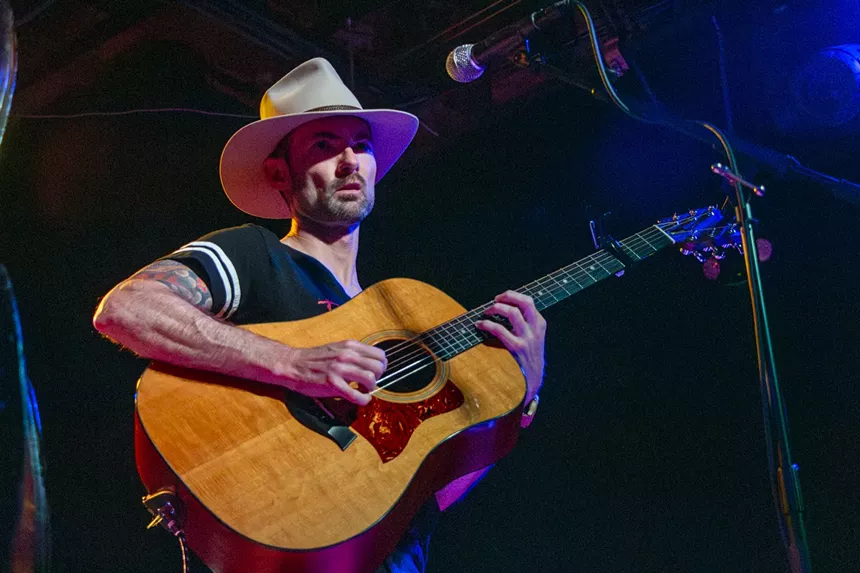 Photo of guy playing guitar