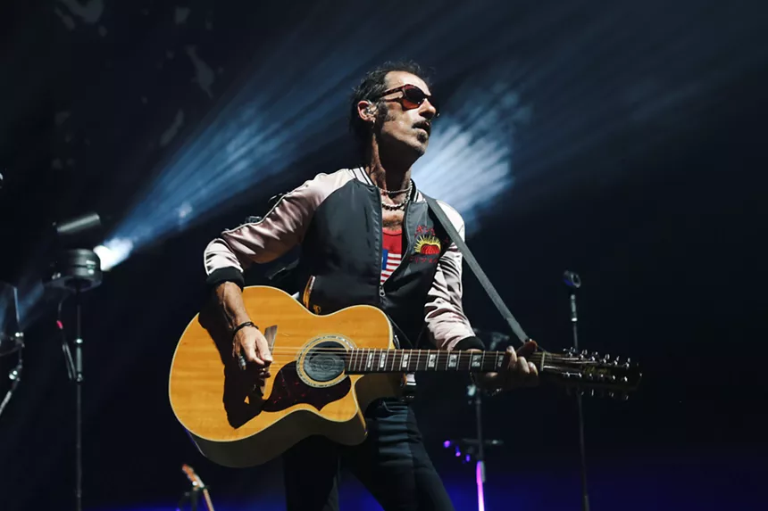 Man playing guitar on stage