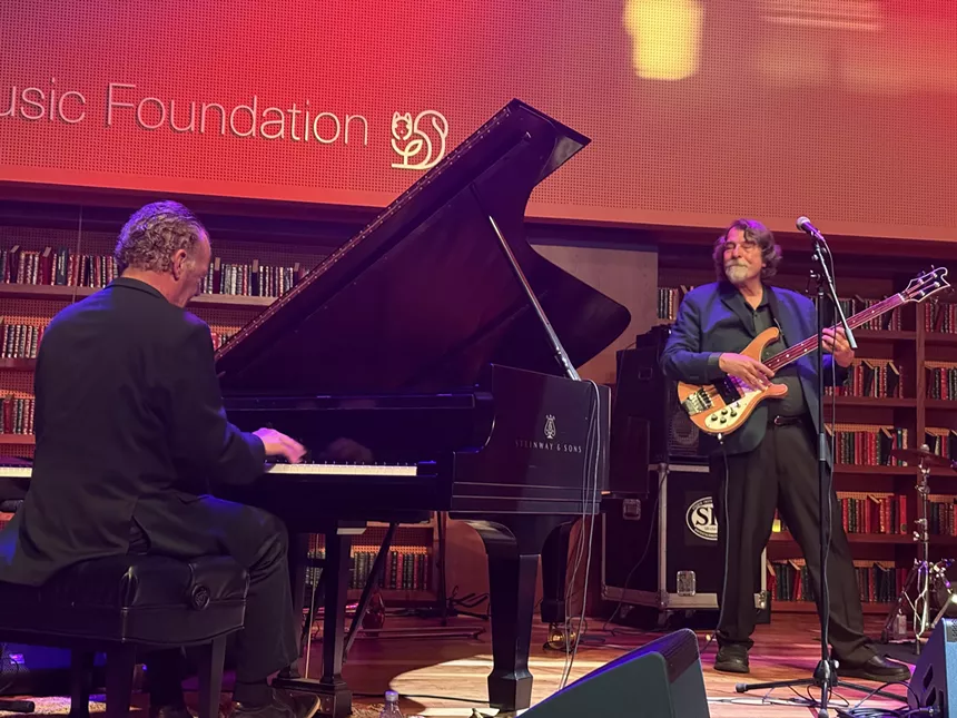 Man playing piano on stage
