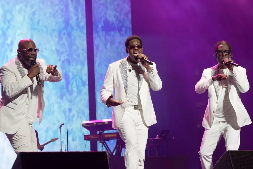 Men singing on stage