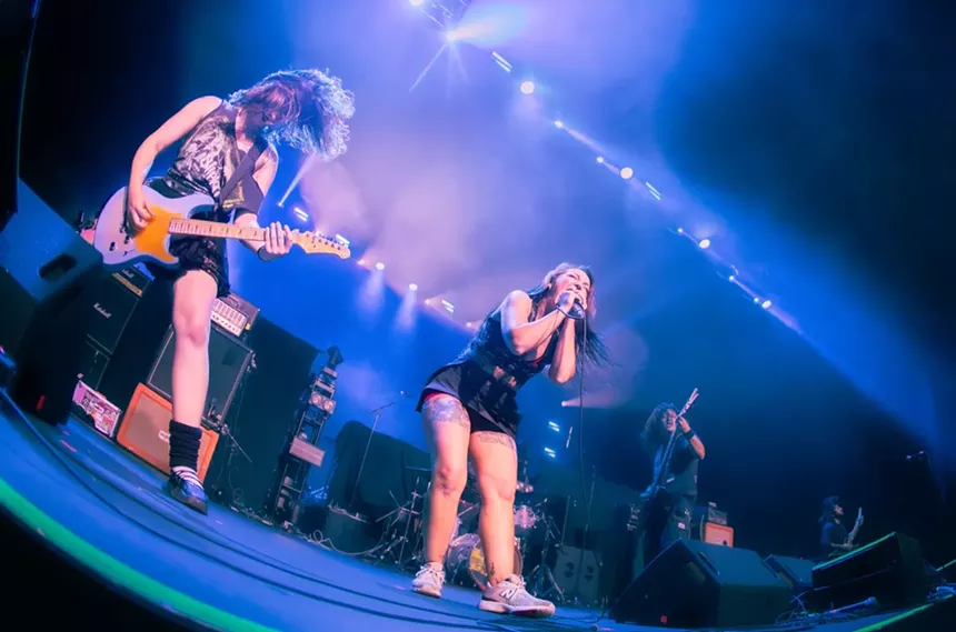 Metal band playing on stage