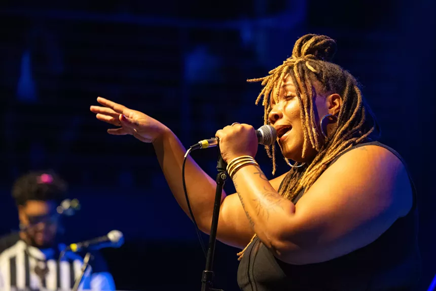 Woman singing on stage