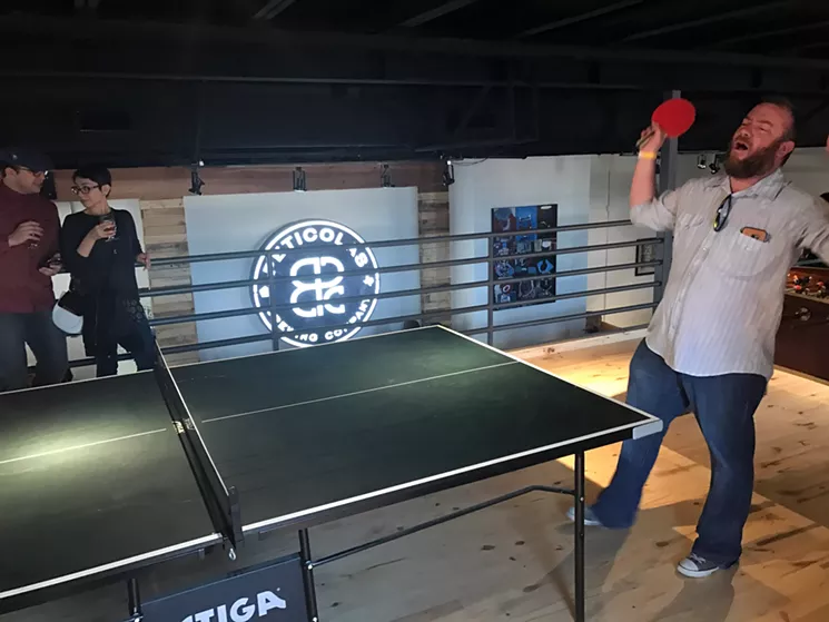 The upstairs area at the new taproom has pingpong and foosball tables, along with a stage for live music. - BETH RANKIN