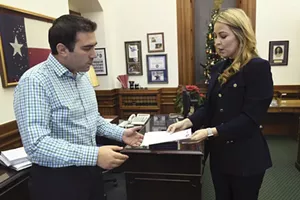 Kate Cochran-Morgan meets with Kevin Fletcher, legislative aide for state Senator Jane Nelson, while lobbying for medical marijuana on Dec. 14, 2016. - JOHN ANDERSON