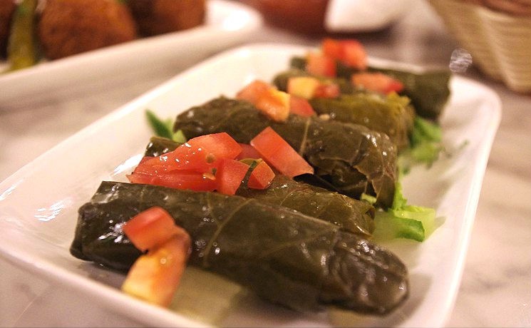 Waraq enab, grape leaves stuffed with a mix of rice and vegetables, at Zatar. - SUSIE OSZUSTOWICZ