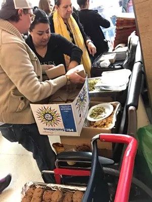 Dallas chefs and restaurateurs took a massive car-load of food to DFW airport protesters and attorneys working to free detainees on Sunday. - COURTESY OF AMY WALLACE COWAN