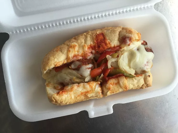 The no-fuss, under seven-buck meatball sandwich — with onions and peppers — at Jimmy’s Food Store. It's one of their most popular orders. - NICK RALLO