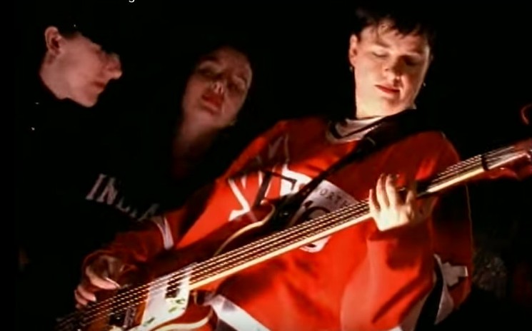 Former Toadies bassist Lisa Umbarger sports the classic Fort Worth Fire red. - SCREENSHOT FROM TOADIES' POSSUM KINGDOM MUSIC VIDEO