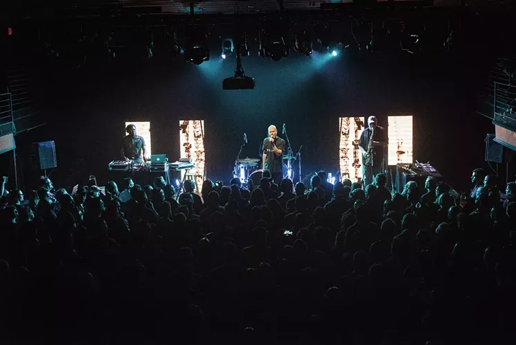 Nearly 500 people stood shoulder-to-shoulder on the ground floor and crammed the side aisles of the Kessler - MIKE BROOKS