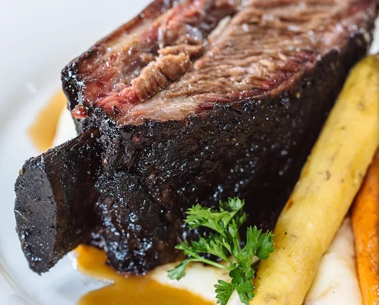 Brontosaurus bone-smoked short rib with Parmesan mash and roasted asparagus at Smoky Rose. - KATHY TRAN/COURTESY OF SMOKY ROSE