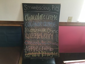 Pie options from the dozens of possible varieties are listed daily on this chalkboard. - TIM COX