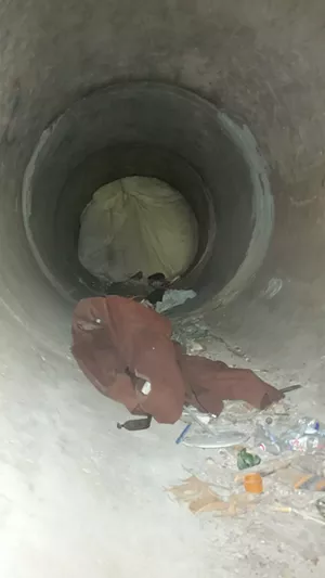 A dozen feet inside the tunnel, entering from the Oak Cliff Founders Park side. Previous tunnel residents say the obstruction helps control mosquitoes. - JOE PAPPALARDO