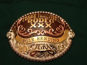 A Texas Tradition belt buckle - VIA TEXAS GAY RODEO ASSOCIATION ON FACEBOOK