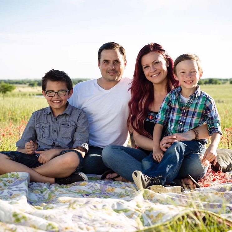 Amanda Servis with husband Micah and two children. - MARCUS JUNIUS LAWS