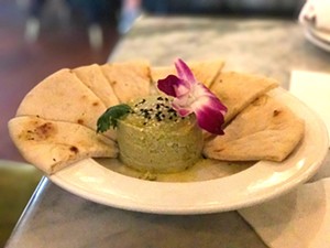 The edamame hummus ($8) is bizarrely garnished with a purple orchid. - BETH RANKIN