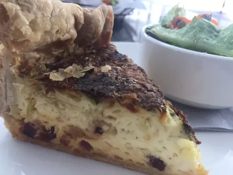 The quiche is a deep-dish beauty, sitting as tall as an 8-inch layer cake in a diner case. - KATHRYN DEBRULER
