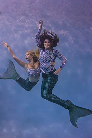 Dobbs (right) poses underwater with fellow mermaid, Ashton Larson. - CAN TURKYILMAZ