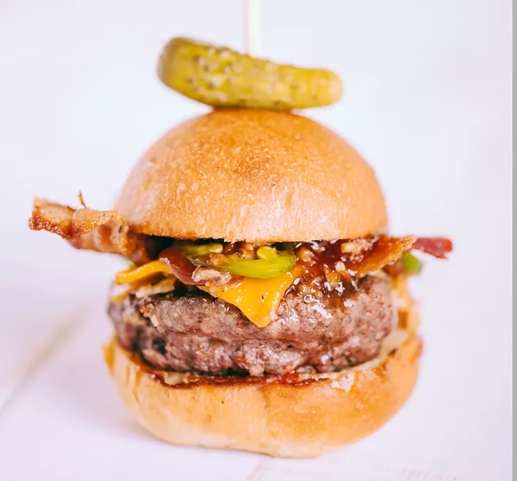 The Roadside has cheddar, bacon, barbecue sauce, grilled jalapeños and crispy onion strings. - EASY SLIDER